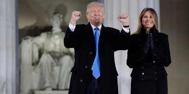 President-elect Donald Trump and his wife Melania Trump arrive at a pre-Inaugural "Make America Great Again! Welcome Celebration" at the Lincoln Memorial in Washington, Thursday, Jan. 19, 20