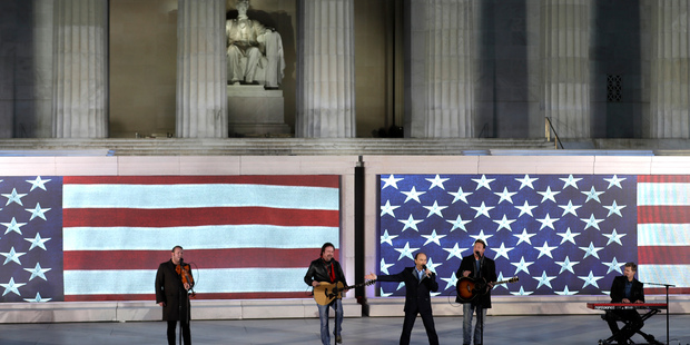 Lee Greenwood sings, third from left, with the backing of the Frontmen of Country at a pre-Inaugural "Make America Great Again! Welcome Celebration" at the Lincoln Memorial in Washington, Th