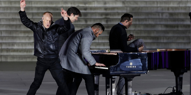 The Piano Guys perform at a pre-Inaugural "Make America Great Again! Welcome Celebration" at the Lincoln Memorial in Washington, Thursday, Jan. 19, 2017. (AP Photo/David J. Phillip)