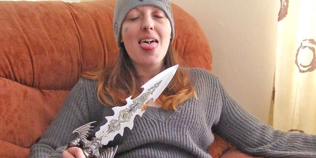 Serial killer Joanna Dennehy poses with a decorative dagger while on the run for murder. Photo / PA