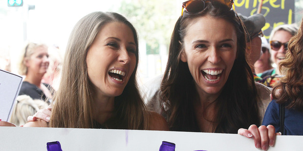 Lizzie Marvelly and Jacinda Ardern take part in the Women against Trump demonstration Queen Street. Photo / Doug Sherring