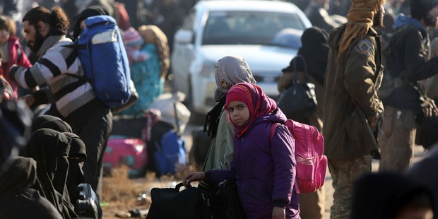 Syrians evacuated from the embattled Syrian city of Aleppo during a ceasefire arrive at a refugee camp in Rashidin, near Idlib, Syria, in December. Photo / AP