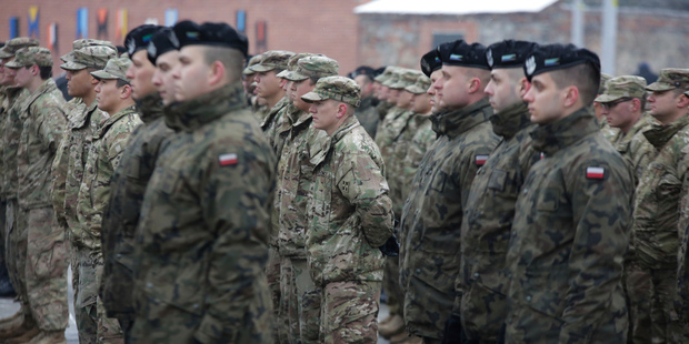 Polish and US soldiers attend the official welcoming ceremony of the US troops in Zagan, Poland, earlier today. Photo / AP
