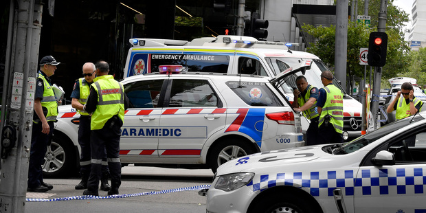 Police and rescue vehicles are parked after a car struck pedestrians in the central business district of Melbourne. Photo / AP