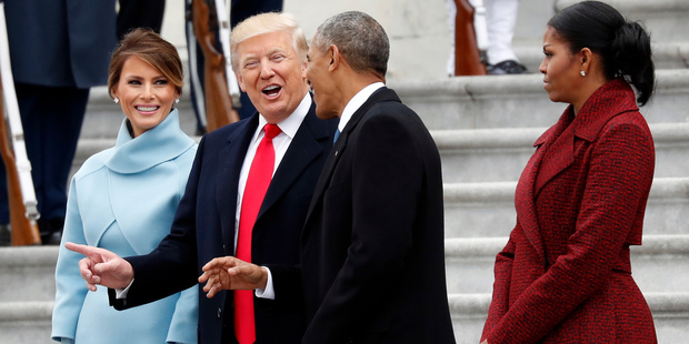 President Donald Trump and first lady Melania Trump talk with former President Barack Obama and Michelle Obama during a departure ceremony. Photo / AP