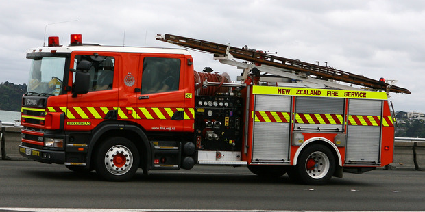Fire crews were called to help free two people trapped following the crash. Photo / File