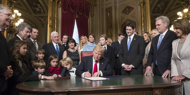 Trump is joined by the Congressional leadership and his family as he formally signs his cabinet nominations into law. Photo / Getty Images