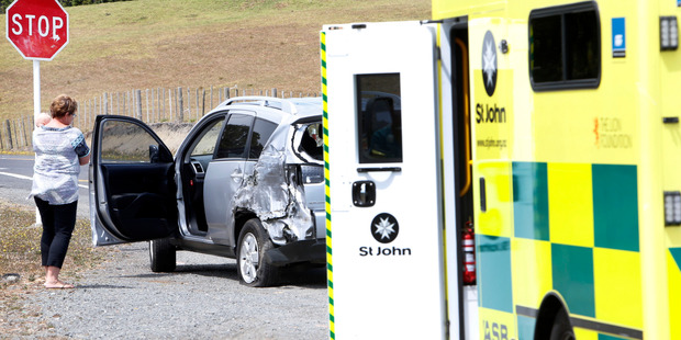 This car was damaged after a collision with a logging truck. Photo / John Stone