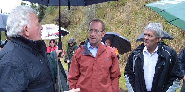 Andrew Little and West Coast-Tasman MP Damien O'Connor talk to Bernie Monk at the Pike River picket this morning. Photo / Greymouth Star