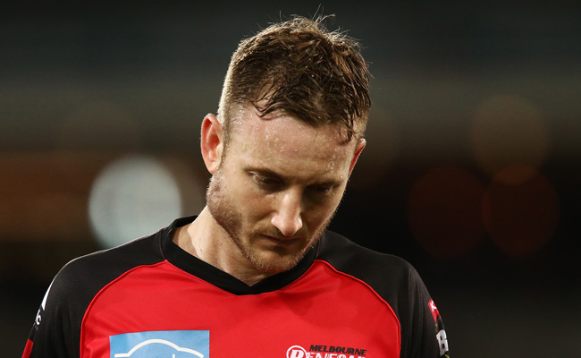 Peter Nevill leaves the field after being hit in the face. Photo /Getty
