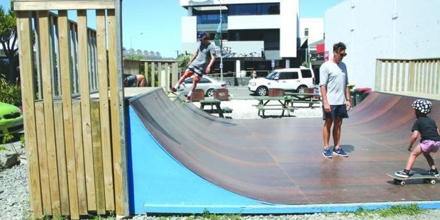 Simon (left) skates the half pipe while Mark Townshend shows his son Jet, 4, some moves. Photo / Annabelle Dick