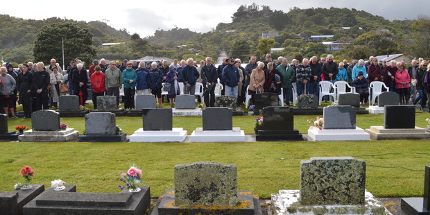 The crowd at the Karoro Lawn Cemetery this morning for the minute's silence at 10.04am, exactly 50 years on from the Strongman Mine disaster that claimed the lives of 19 men. Photo / Greymouth StarHerald Archives