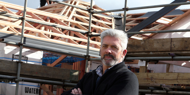 Bella Homes owner Simon Crawford in Donald St, Whangarei, where his company is building four townhouses despite a fall in home affordability in Northland.
PHOTO/JOHN STONE