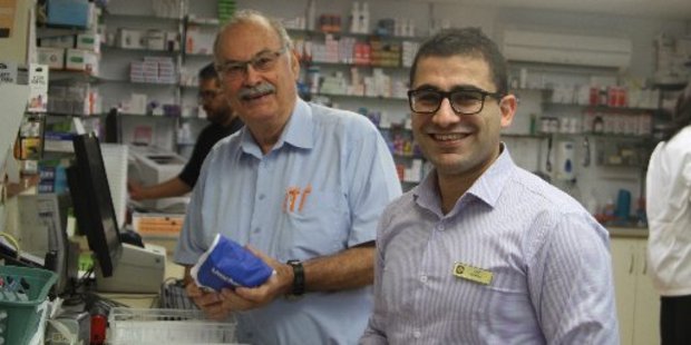 Eric Shackleton, who planned to stay six months when he arrived in Kaitaia in 1973, and his successor at Shackleton's Unichem, Atif Malkonyan.
