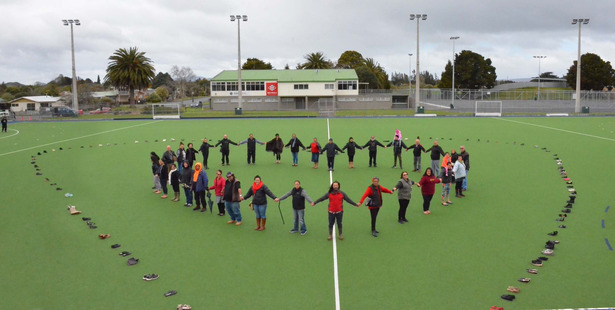 Supporters of Kaikohe's contribution to National Suicide Awareness Day form a heart inside a heart of shoes representing those who took their own lives in the last year. Photo / Debbie Beadle