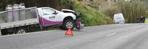 Police are continuing to investigate a crash between a small truck carrying gas cylinders and a van full of money.