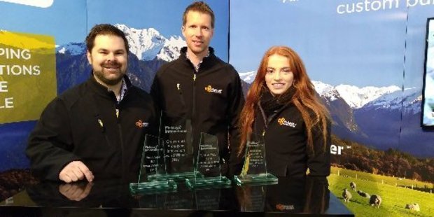My Apiary co-founders Darren Bainbridge and Carl Vink, and marketing intern Steph Fankhauser with the four Fieldays innovation awards the company won this year.