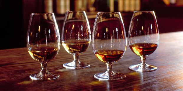 If you're bored of craft beer, opt for a whiskey tasting instead. Photo / Getty Images