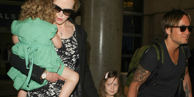 Nicole with her husband Keith Urban and their daughters Sunday Rose and Faith Margaret. Photo / Getty