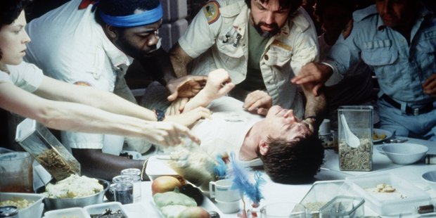 Sigourney Weaver, Ian Holm, John Hurt (on table), Tom Skerritt, Veronica Cartwright, and Yaphet Kotto in Alien (1979). Photo / Supplied