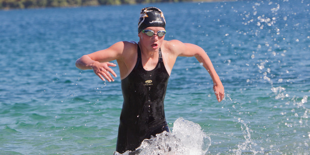 Rotorua's Milla Theobold coming out of the water at the end of the Hinemoa Swim. PHOTO/ BEN FRASER
