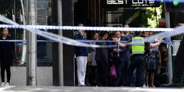 Police at the scene near Flinders St station. Photo / AP
