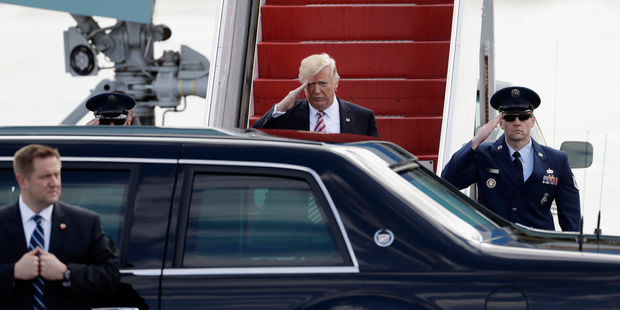 President Donald Trump salutes before getting into his vehicle after arriving on Air Force One at the Philadelphia International Airport. Photo / AP
