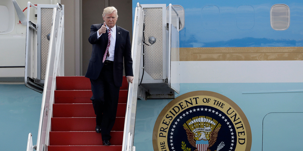 President Donald Trump gives a thumbs-up as he arrives on Air Force One. Photo / AP