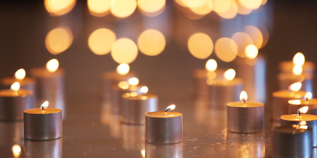 Candles lit by transplant recipients during a remembrance service for organ donors at St Paul's Cathedral in Wellington during 2015. Photo / File