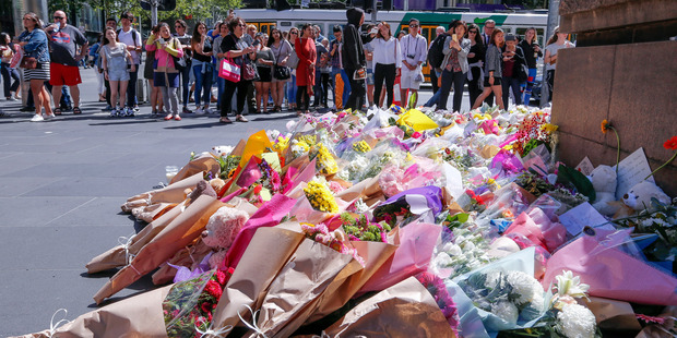 Mourners leave flowers and tributes to the victims of the Melbourne incident. Five people, including a three-month-old baby boy, have now died. Photo / AP
