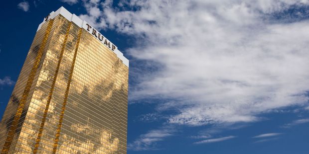 Most ethics experts, including the agency that monitors such matters in the federal government, have said Trump should divest his holdings entirely. Photo / 123RF