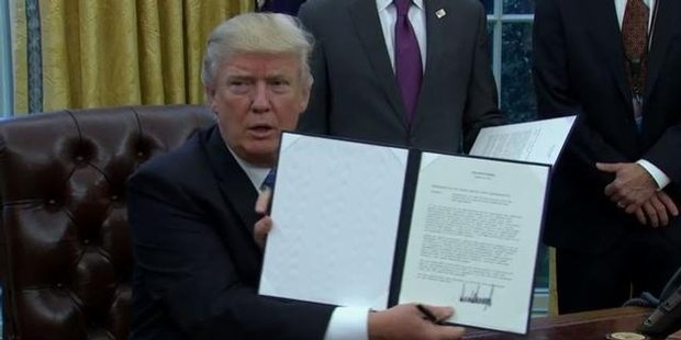 Watch Trump signs executive order to pull USA from TPP