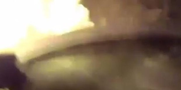 Watch Woman pulled from burning car by cop 'angel'