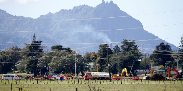 Farmland at Ruakaka becomes the site of intense activity as workers try to fix the ruptured pipeline.
