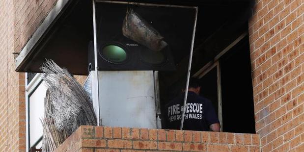 The fire forced the parents to drop their daughter from the flat above into the arms of neighbours below. Photo / News Corp Australia