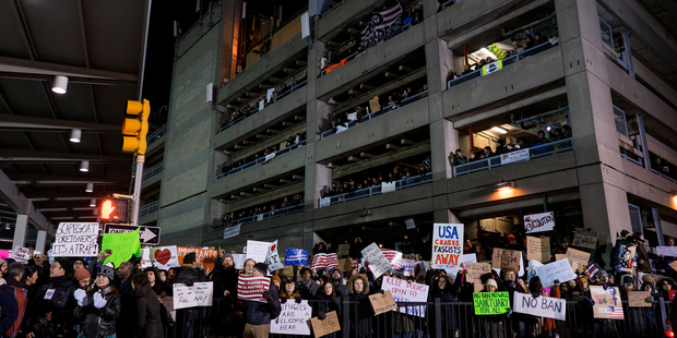 Protesters assemble at John F. Kennedy International Airport in New York, Saturday. Earlier in the day two Iraqi refugees were detained while trying to enter the country. Photo / Craig Ruttle