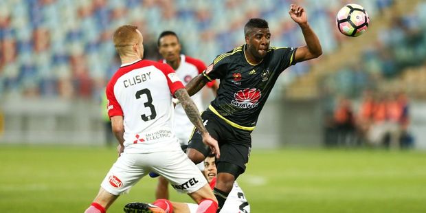 Roly Bonevacia of the Phoenix competes for the ball with Jack Clisby of the Wanderers. Photo / Getty