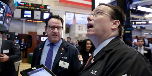Traders Peter Costa, left, and Joseph Murray work on the floor of the New York Stock Exchange. Photo / AP