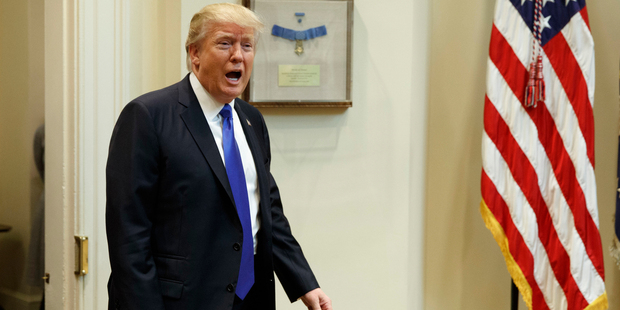 President Donald Trump arrives in the Roosevelt Room of the White House in Washington. Photo / AP