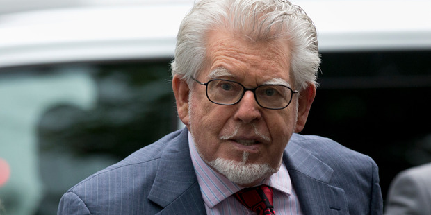 Rolf Harris listened to the evidence against him on headphones. Photo / File