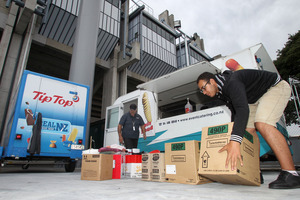 GEARING UP: Ngapaki Gripp (left) and Sherif Riad from Baxters Event Catering loading up the caravans with supplies ready for today's big game. PHOTO/DUNCAN BROWN.