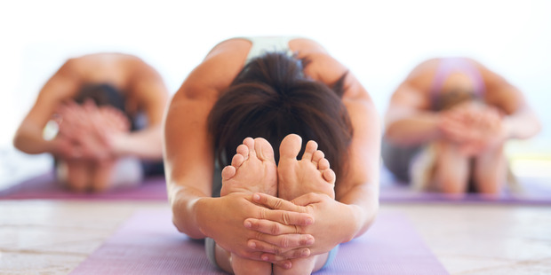 Stretching before and after exercise. Photo / Getty Images