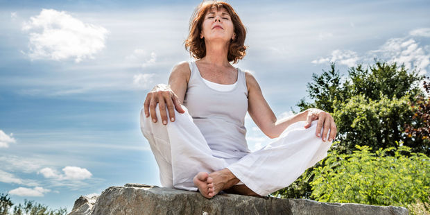Fit 50-year-olds can lower themselves into a cross-legged sitting position without using their hands. Photo / 123rf