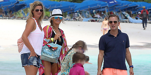 Jeremy Kyle (right) was pictured on a beach in Barbados in 2013 with his former nanny Vicky Burton (far left) and his ex-wife Carla Germaine (second left). Photo / Splash News Australia