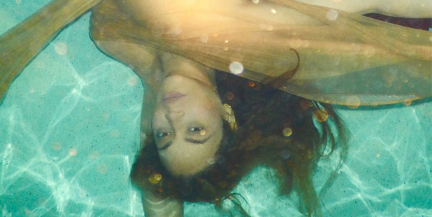 Beyonce floats in water in a new photo posted on her website Beyonce.com.