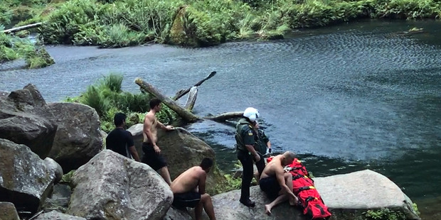 A 24-year-old man being rescued after jumping from the top of Omanawa Falls. Photo/Supplied.