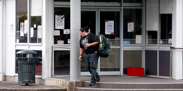 Paramedics leave the complex following the drowning. Photo / Dean Purcell