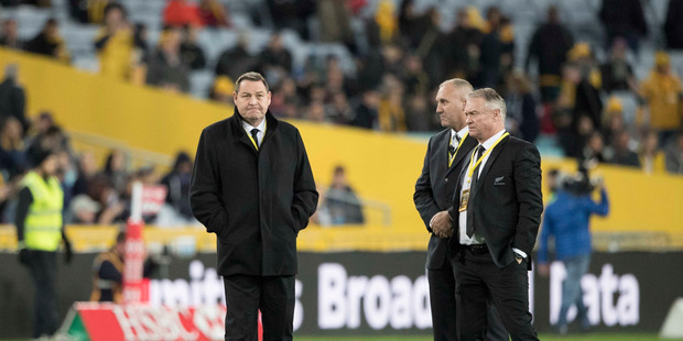 All Blacks coaches Steve Hansen and Grant Fox with one of the All Blacks security detail before the first Bledisloe match in Sydney after the spying scandal broke. Photo / Brett Phibbs