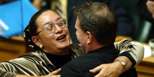 Tim Barnett is hugged by Georgina Beyer after his Prostitution Reform Bill was passed in 2003. Photo / Ross Setford