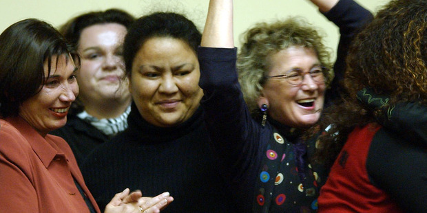 New Zealand's Prostitutes Collective's Catherine Healy, extreme left, and others celebrate in the public galleryt after the Prostitution Reform Bill was passed 2003